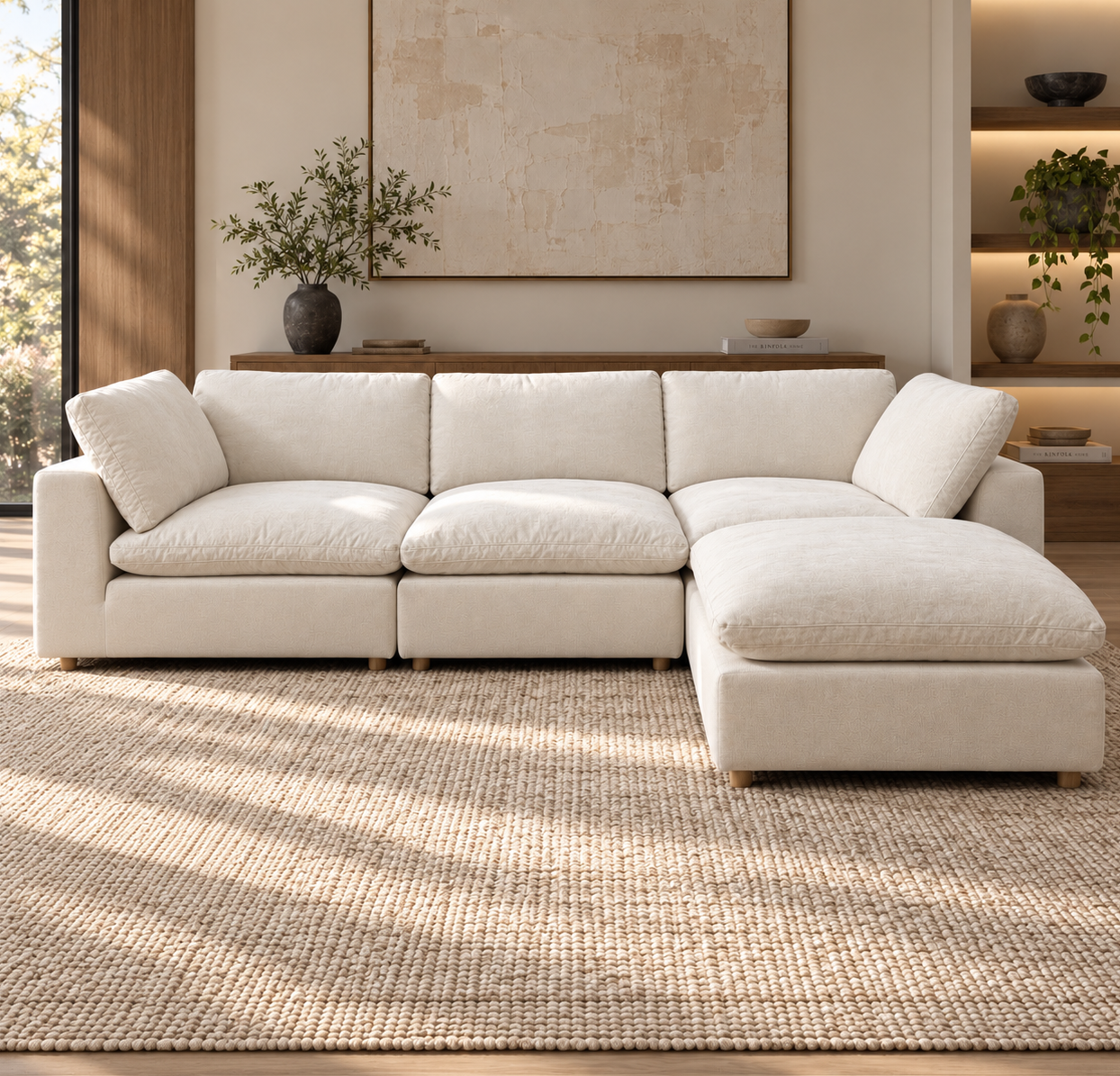 Norwick Beige Down-Filled Cloud Couch — Beige cloud couch with matching ottoman arranged as a chaise, shown in a room.