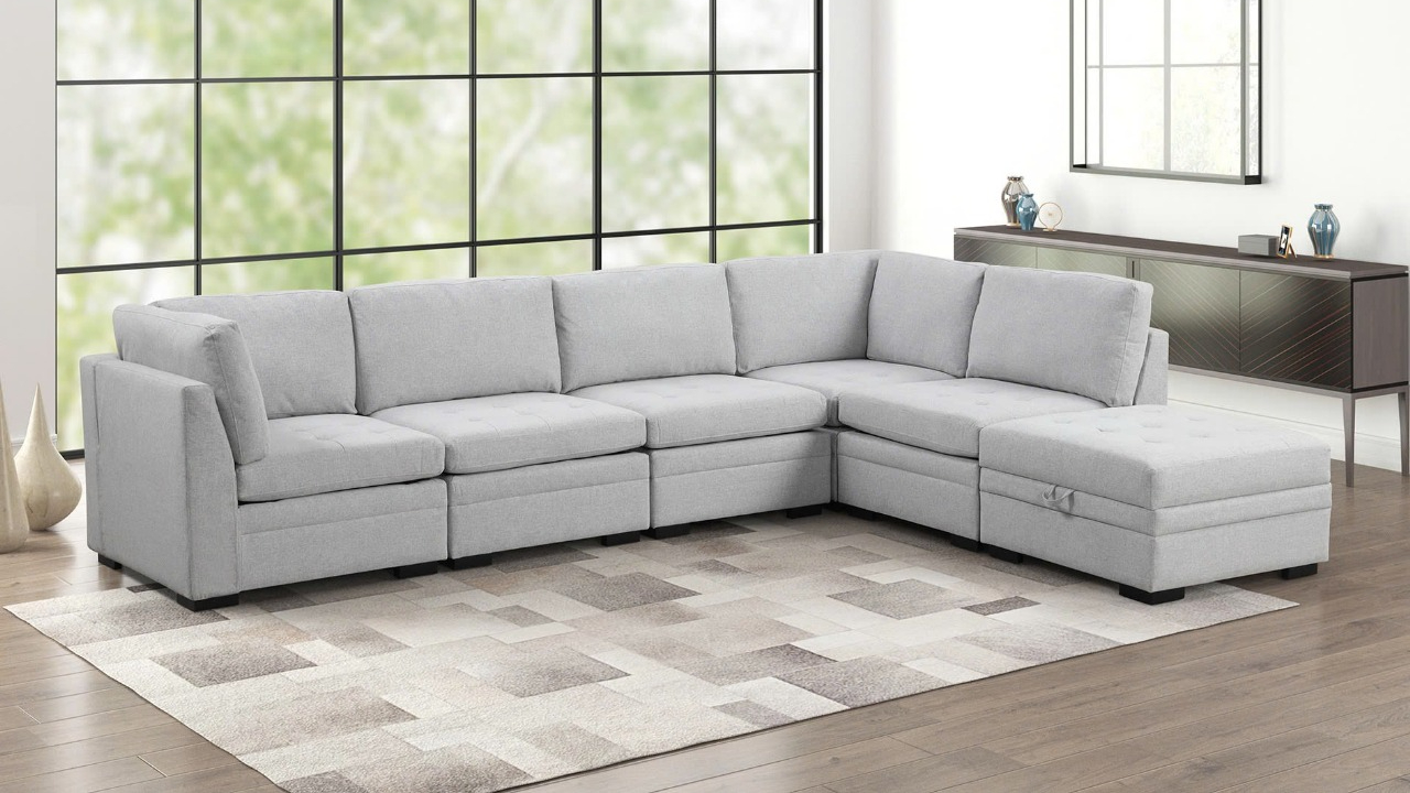 Thomas light grey six-piece modular sectional with a chaise in a bright living room